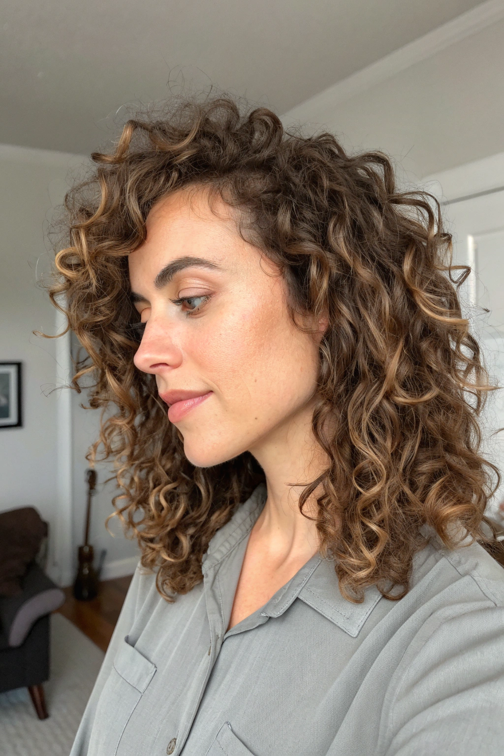 7) curly side bangs with natural texture