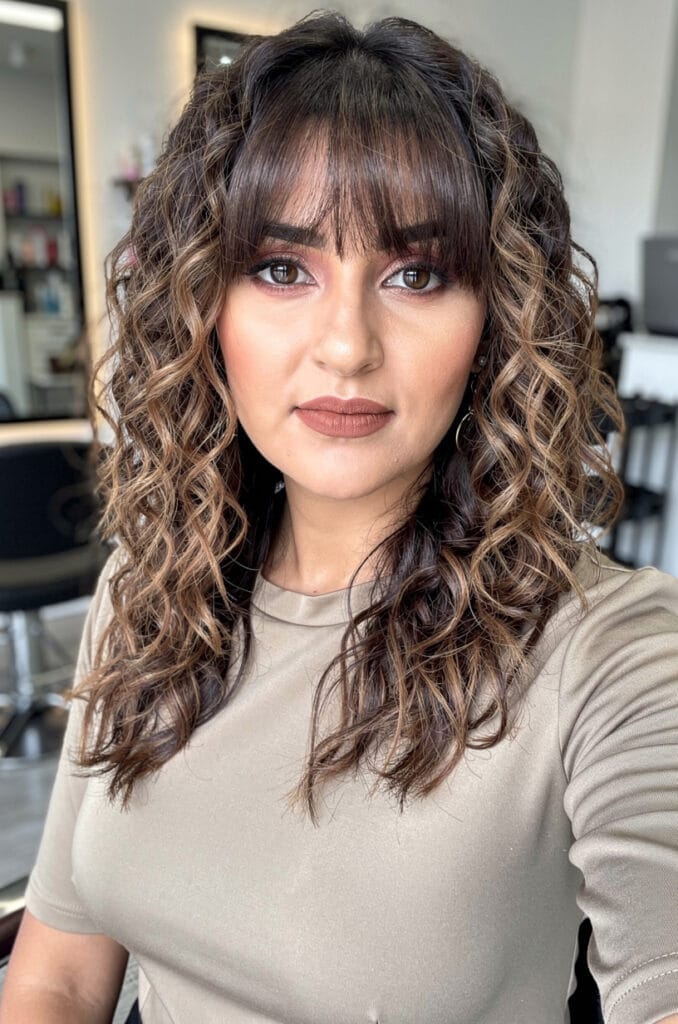 Curly lob with curtain bangs