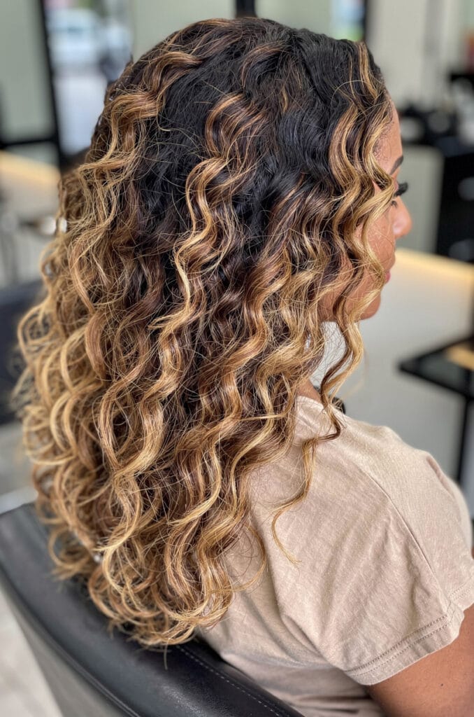 Layered curls with honey highlights