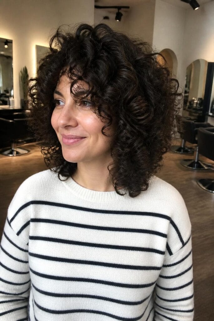 Shoulder length curly cut with rounded layers 683x1024 1
