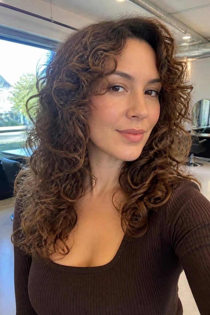 Layered curls with volume at roots 683x1024 1