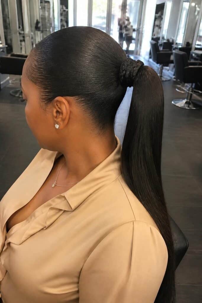 Sleek ponytail with braided wrap 683x1024 1