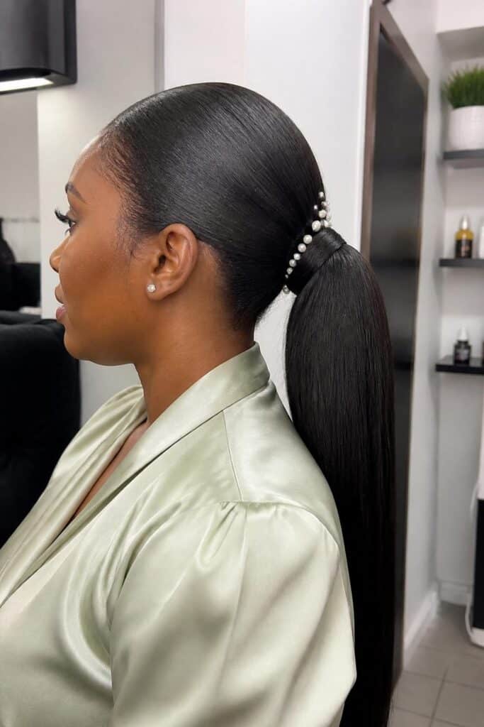 Sleek ponytail with pearl accents 683x1024 1