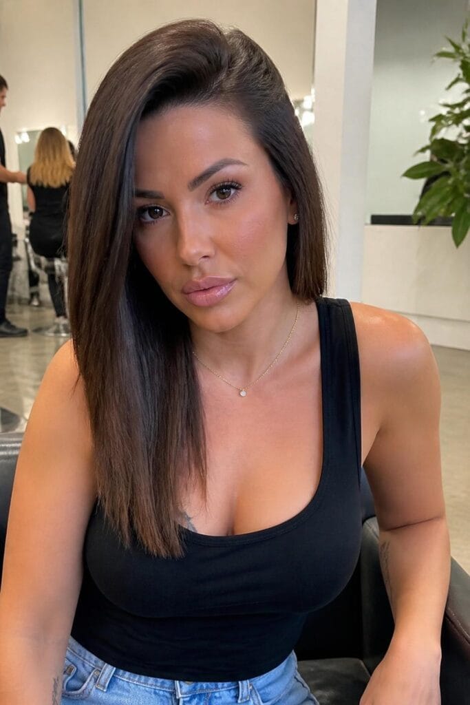 Sleek straight hair with a deep side part 683x1024 1