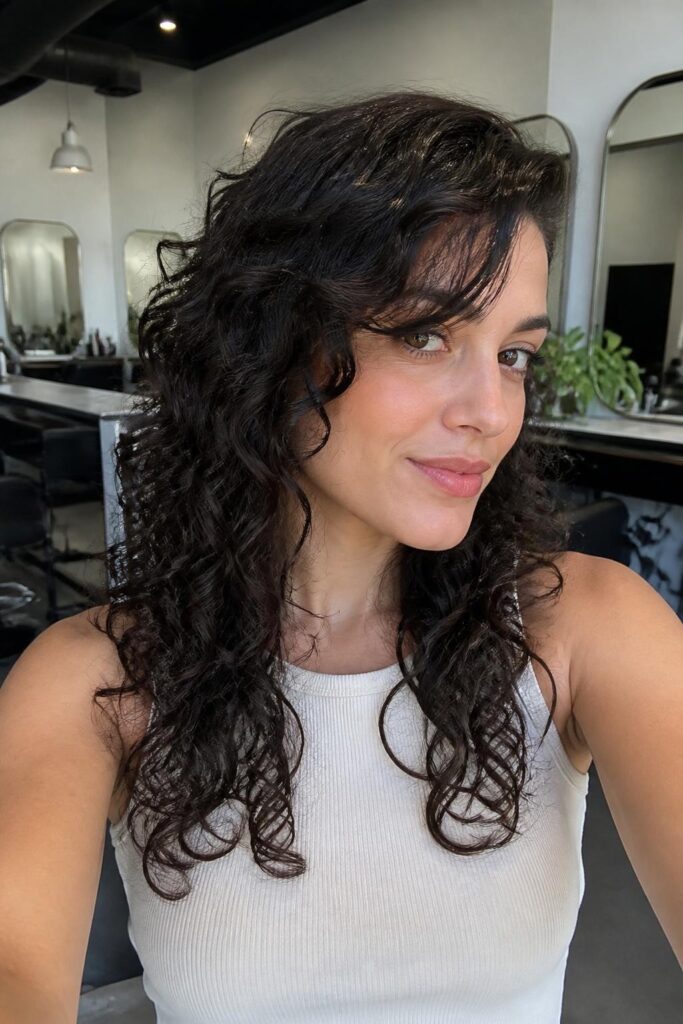 10. Curly shag with side-swept bangs