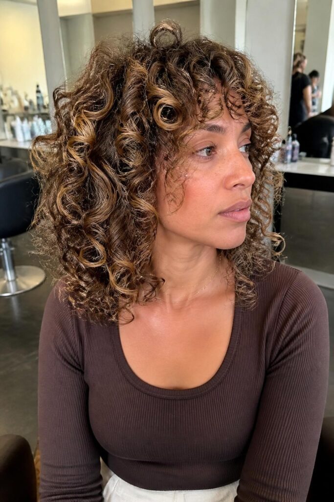 6. Curly shag with highlights