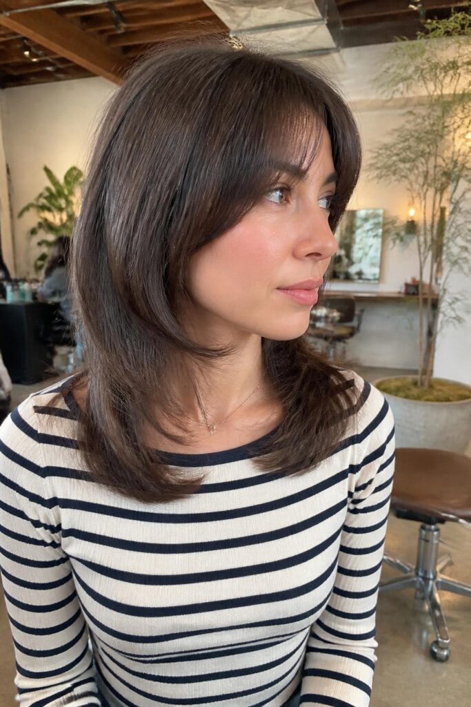 Blunt butterfly lob with bangs