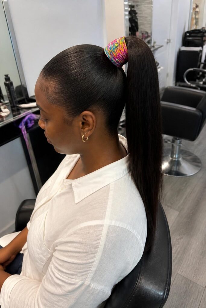 High ponytail with a scarf wrap