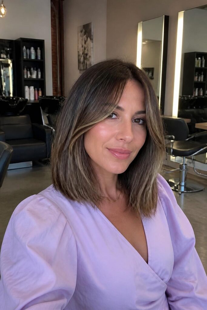 Long bob with curtain bangs and baby lights