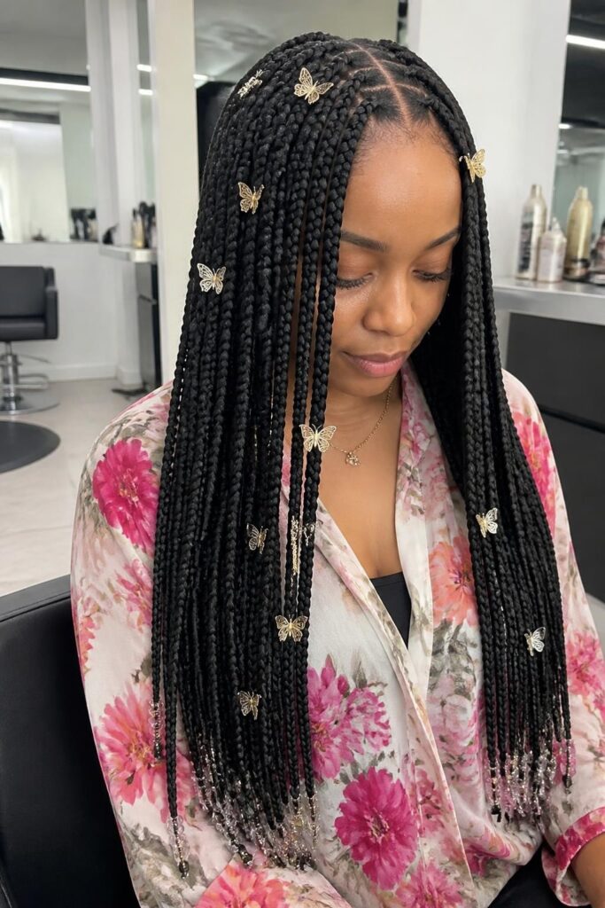 Long boho knotless braids with butterfly accents