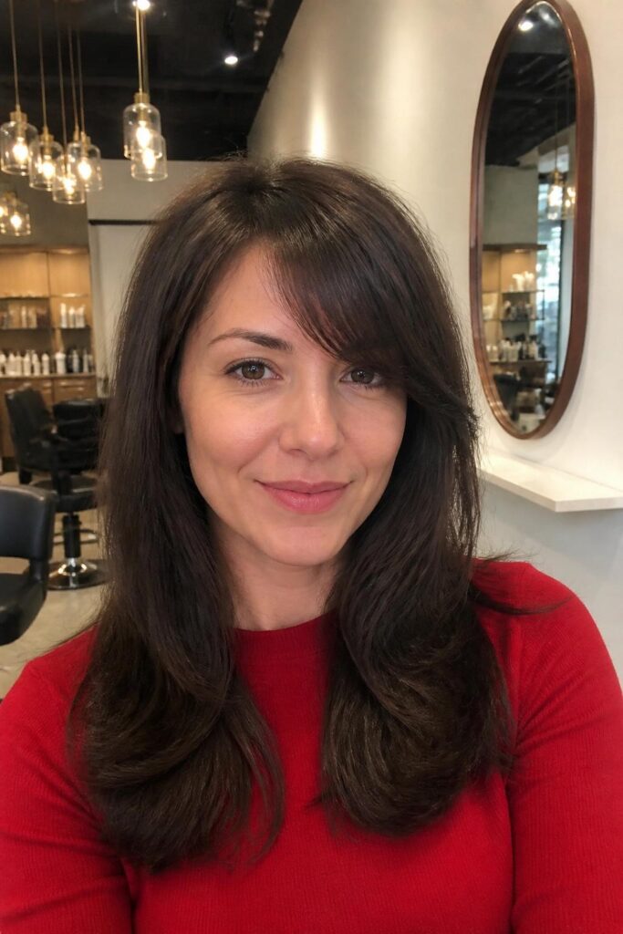 Long layers with side bangs for heart faces