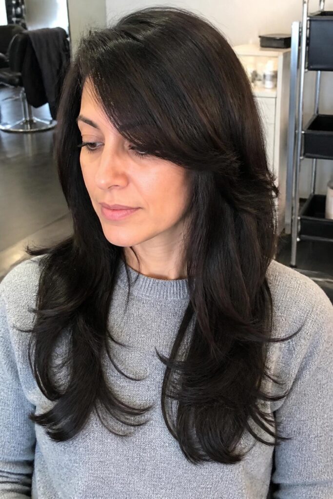 Side swept bangs with long layers 683x1024 1