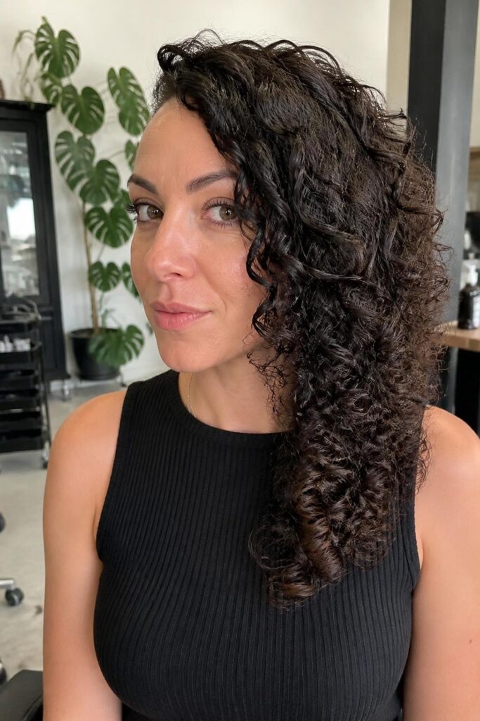 Side swept curls with deep side part