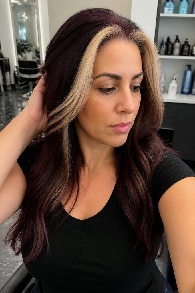 10. Plum hair with face framing blonde streaks