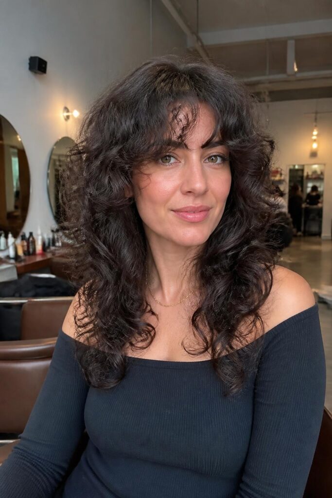 13. Butterfly cut with curly fringe