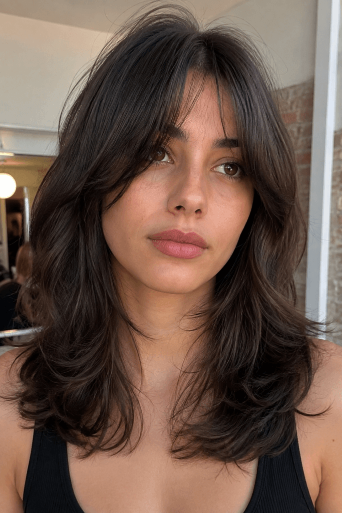 Feathered medium cut with curtain bangs
