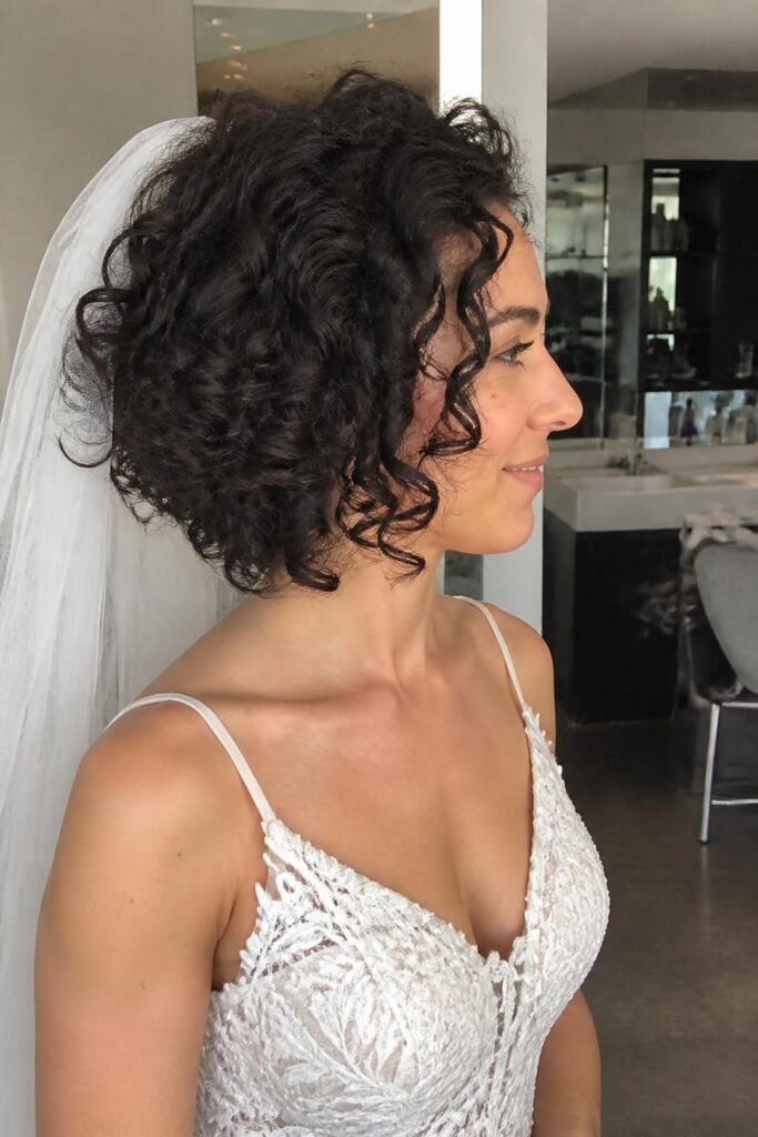 Curly bob with defined curls and veil
