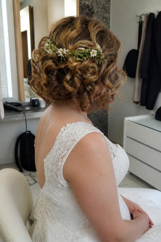 Curly bob with floral hair vine