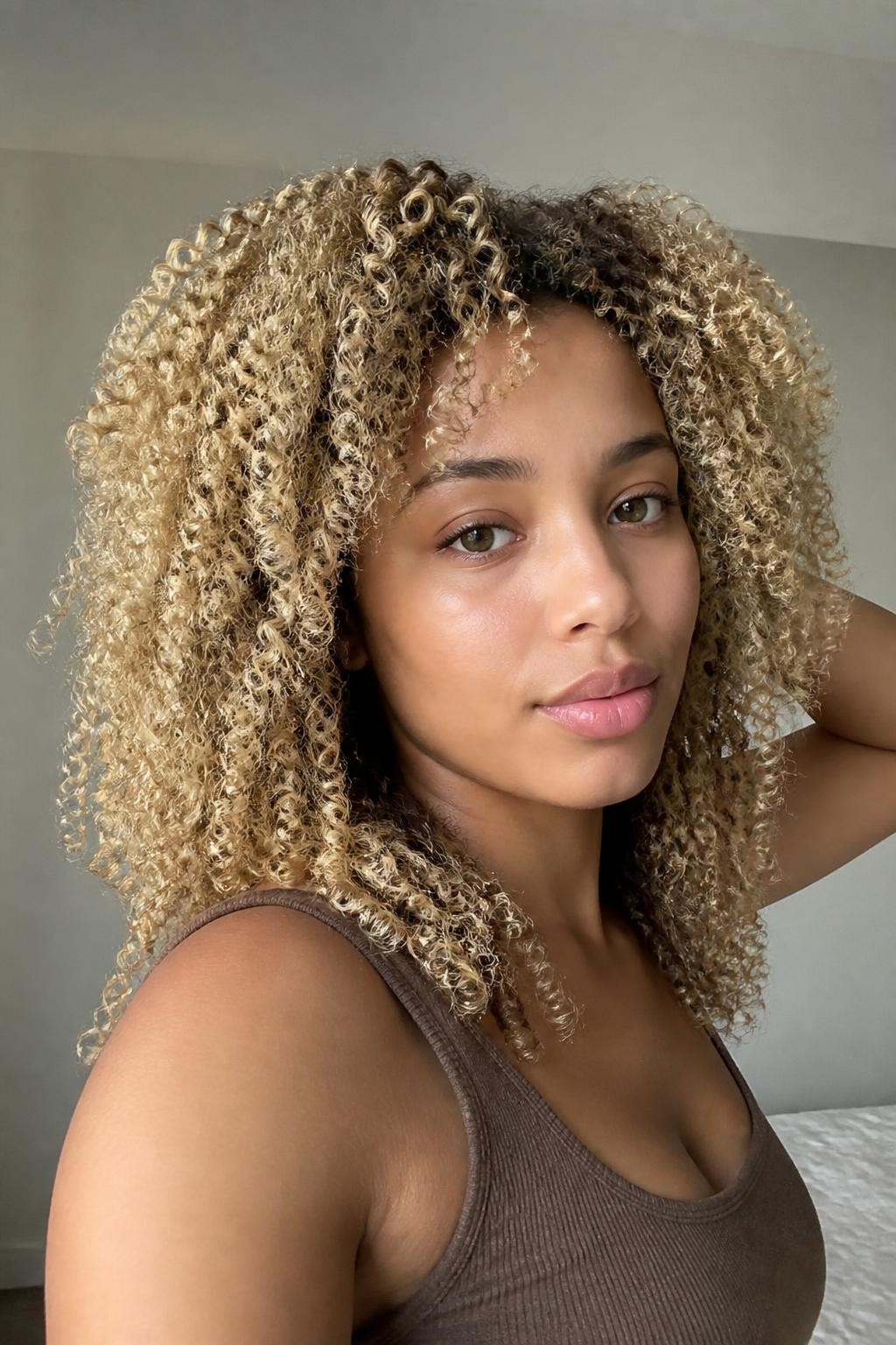 Woman with beige blonde twist-out curls