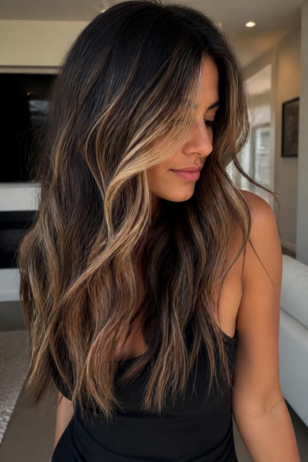 Woman with long dark brown hair with high-contrast neapolitan highlights