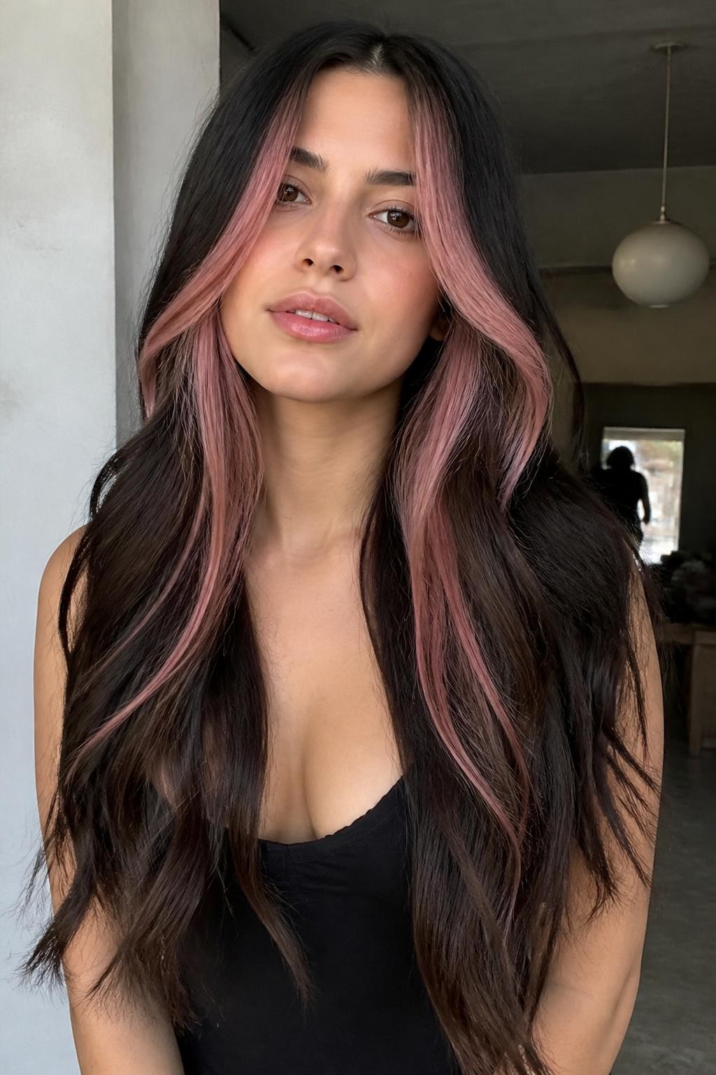 Woman with long hair with neapolitan peekaboo highlights