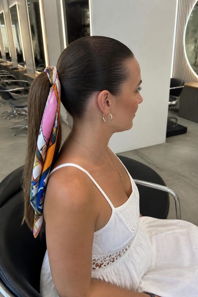 Slick back ponytail with a scarf