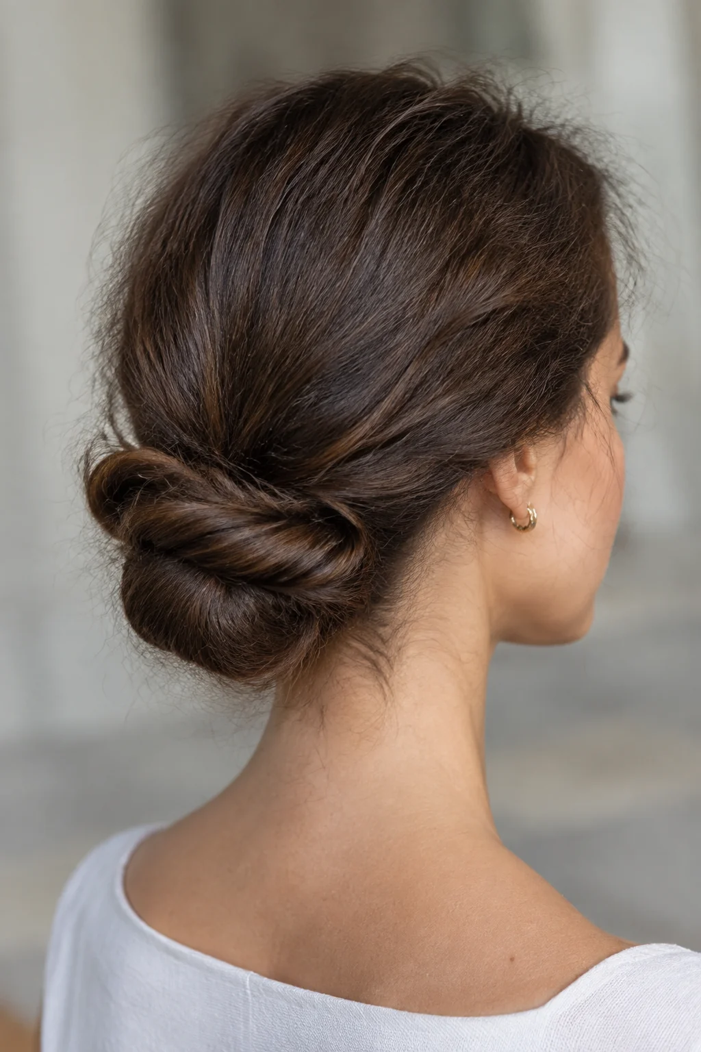 Twisted Low Chignon with Sleek Edges hairstyle
