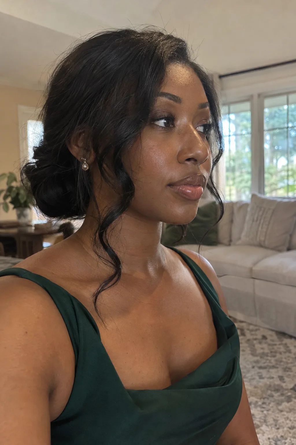 Low Messy Bun With Face-Framing Pieces hairstyle