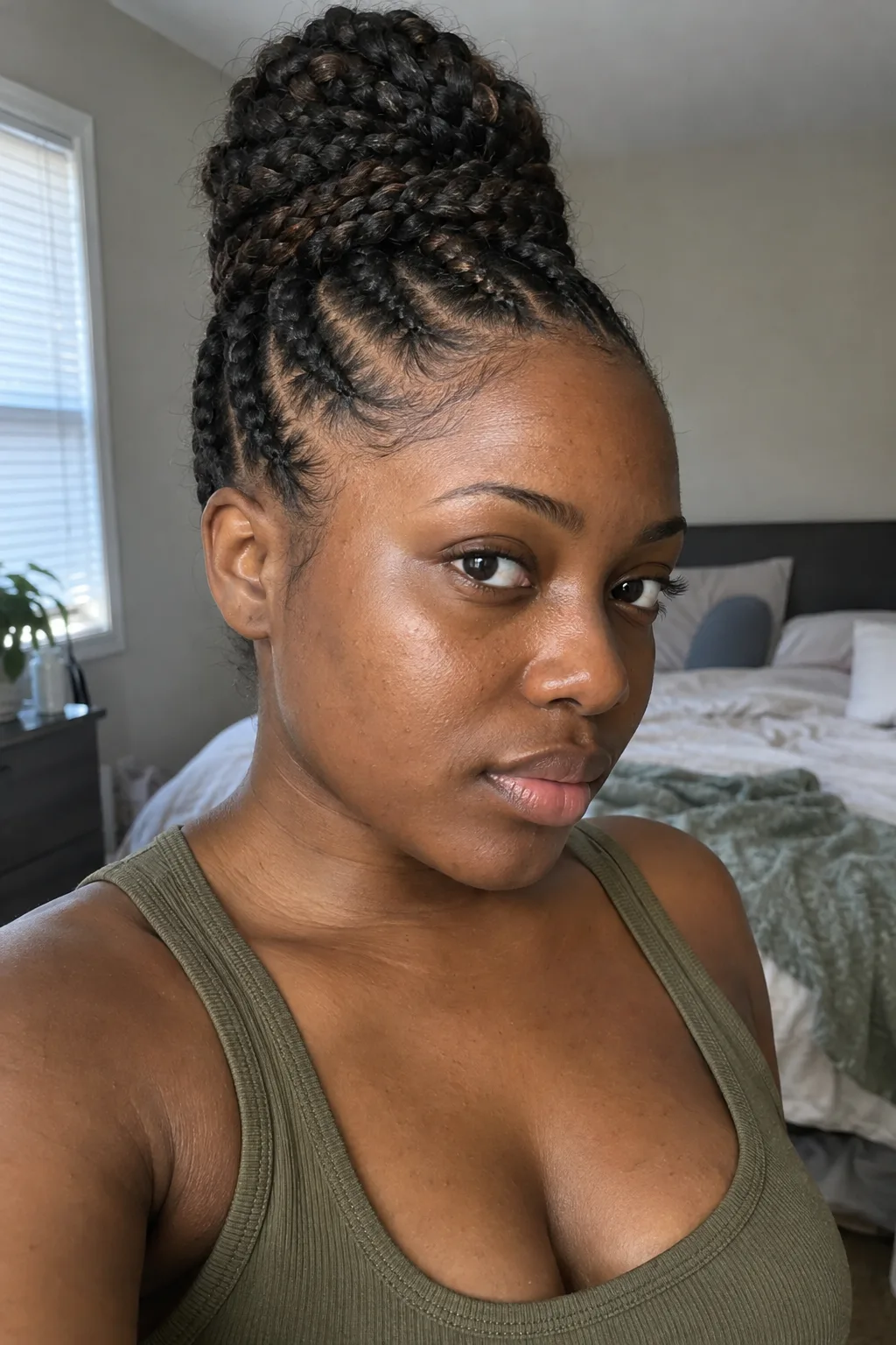 Feed-In Cornrows With a Top Knot hairstyle