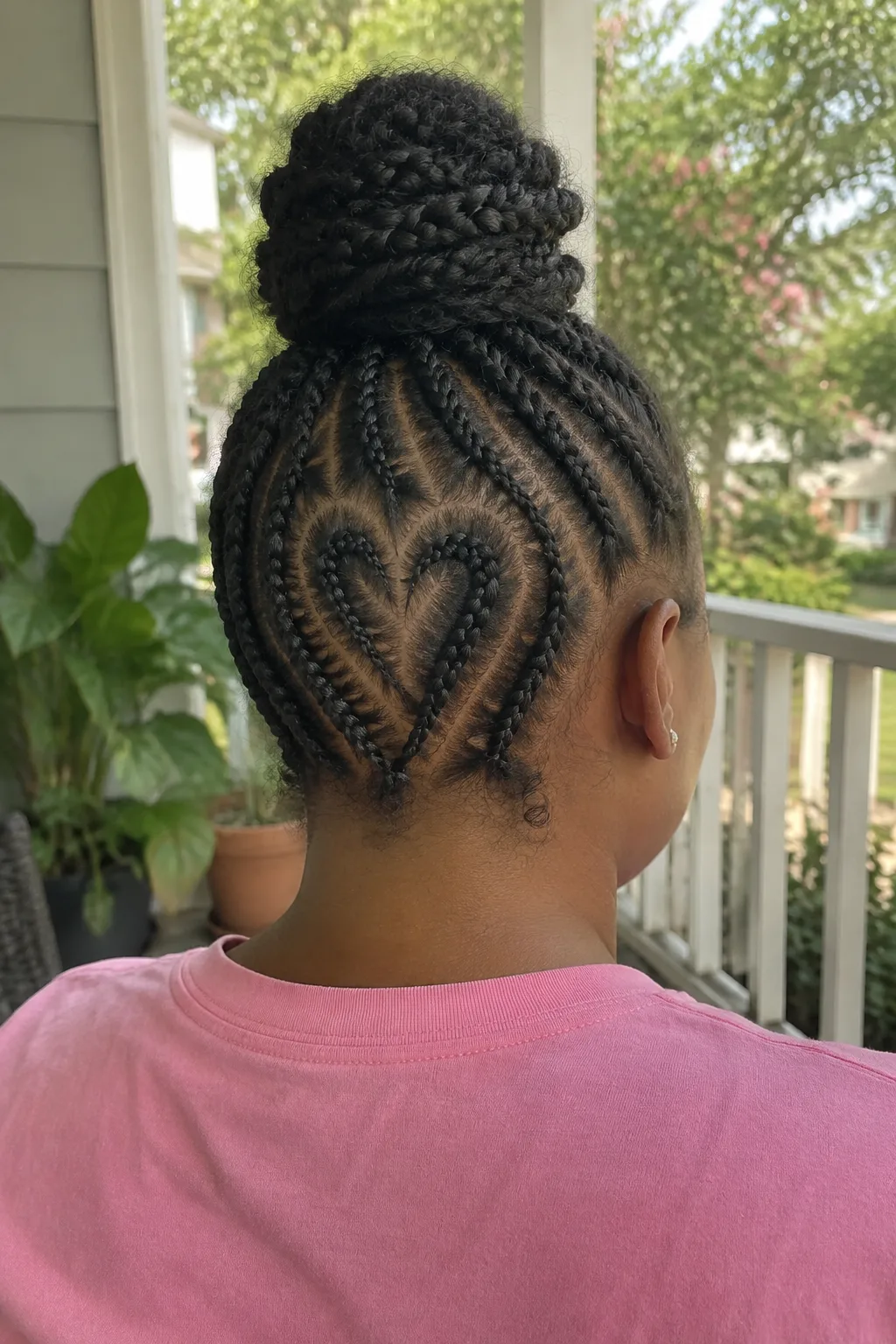 Heart-Design Cornrows With a Bun hairstyle