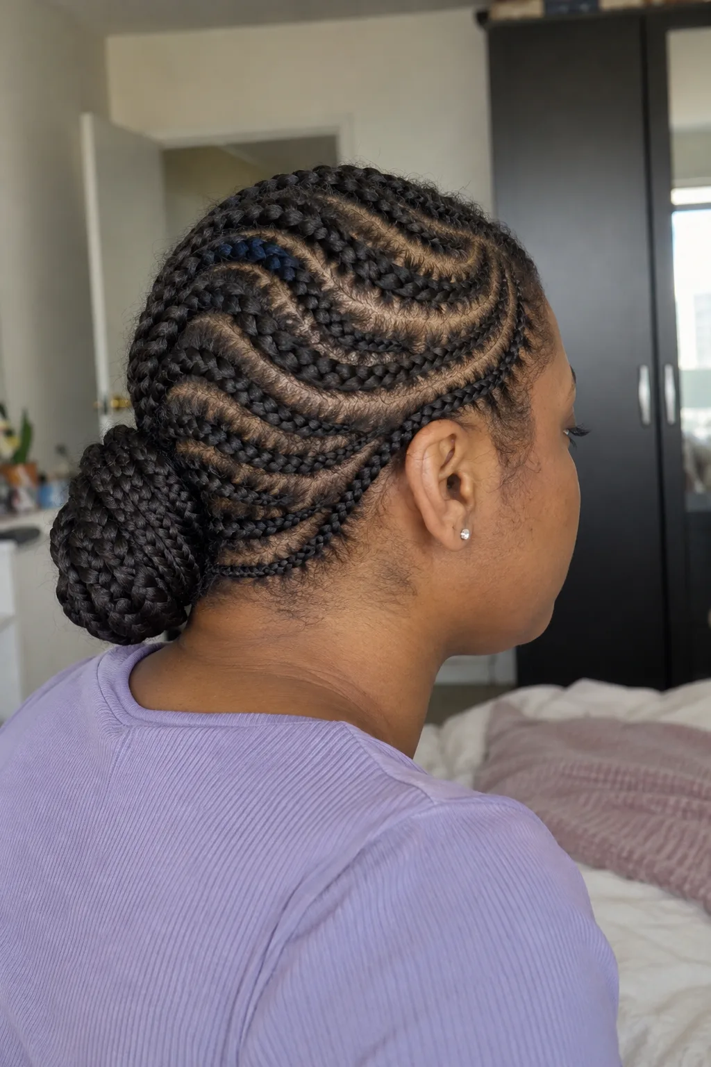 Curved Cornrows With a Wrapped Bun hairstyle