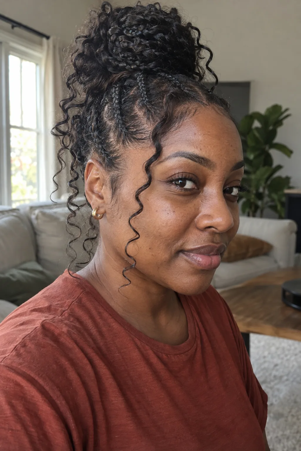 Goddess Cornrows With a Curly Bun hairstyle