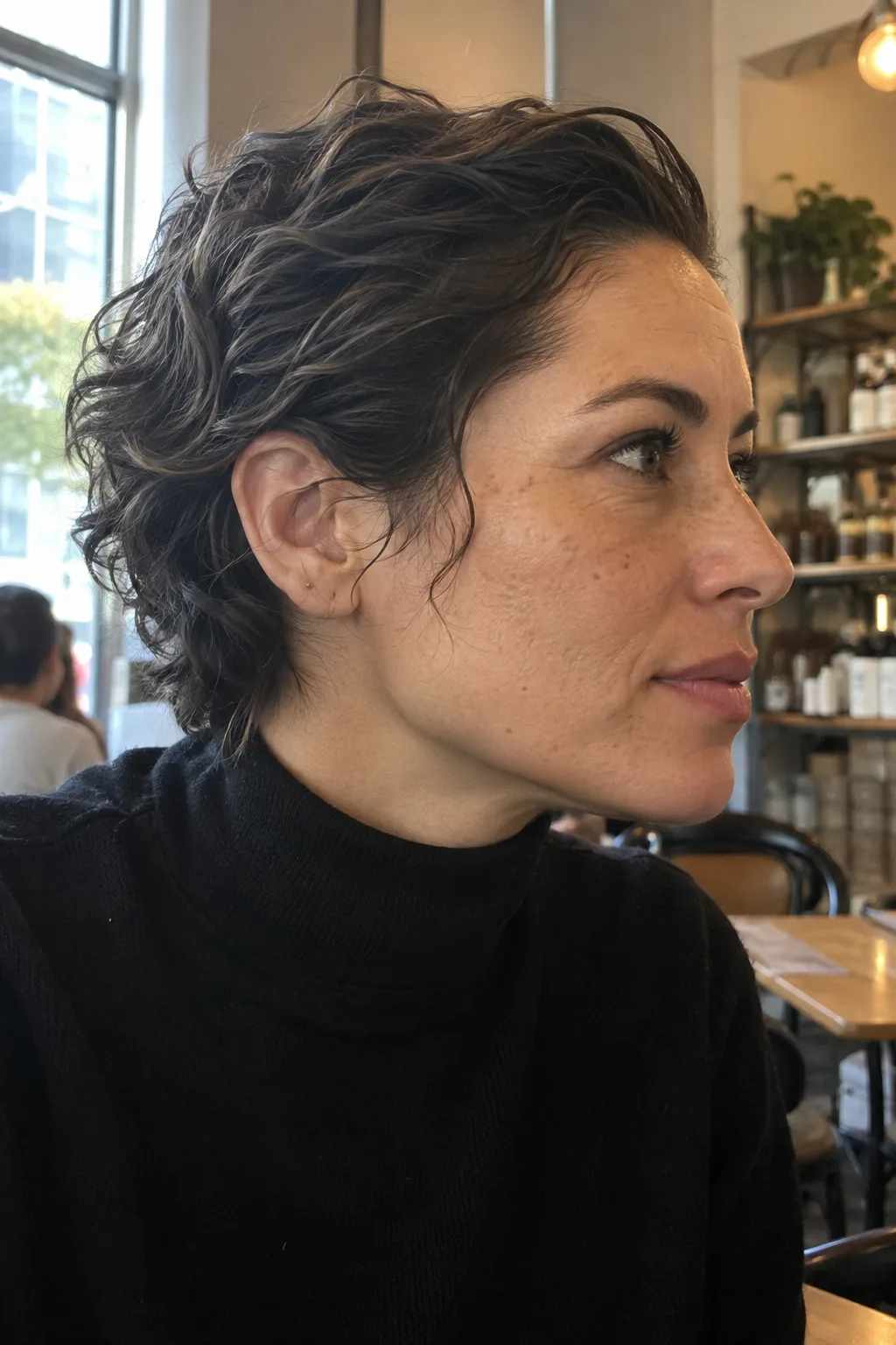 Slicked-Back Wavy Pixie hairstyle